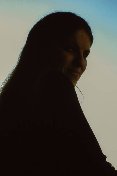 Indian young adult woman profile view silhouette portrait.