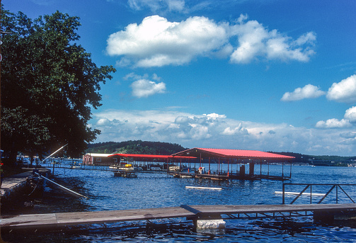 Lake of the Ozarks - Docks Beneath Summer Sky - 1988. Scanned from Kodachrome 25 slide.