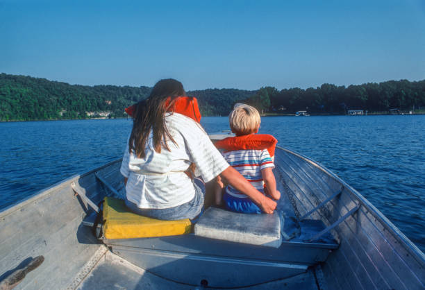 Lake of the Ozarks - Boy with Older Sister in Fishing Boat - 1991 stock photo
