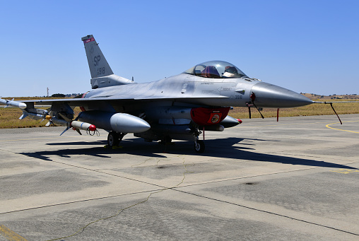 F-16 Fighting Falcon military jets (models) fly through clouds with American flag