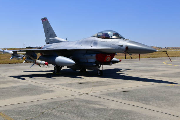 F-16 Fighting Falcon (F-16CJ, the air defenses suppression version) - USAF, Beja Airport, Portugal Beja, Portugal: parked General Dynamics F-16CJ Fighting Falcon of the United States Air Force 480th Fighter Squadron 'Warhawks', 52nd Fighter Wing, based in Spangdahlem Air Base, Germany configured for Suppression of Enemy Air Defenses - weapons on the wing: AIM-120 AMRAAM, middle AIM-9 Sidewinder, right AGM-88 HARM - Beja Airport serves both civil and military aviation. sidewinder missile stock pictures, royalty-free photos & images