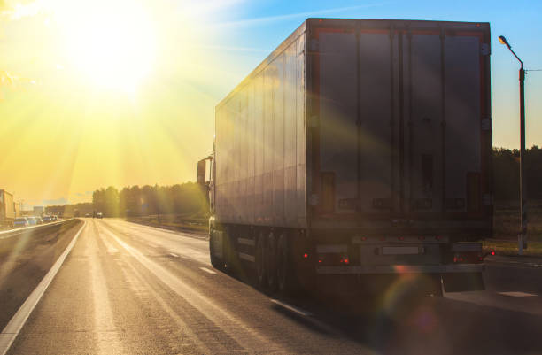 istock Truck Goes On Highway On the Sunset 1491793835
