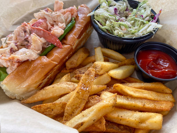 Lobster roll on a brioche bun with fries