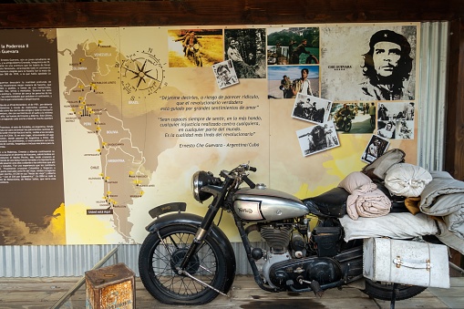 Puerto Blest, Argentina, February 22, 2023: Information Table with Ernesto Che Guevara, famous Argentine Rebel Leader, his equipment and motorcycle at Paso International Perez Rosales Border Crossing