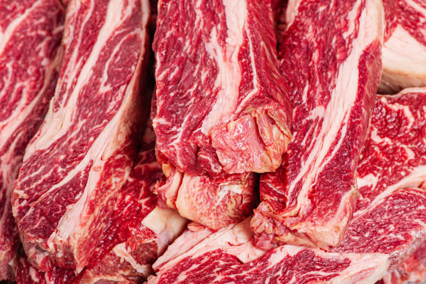 istock Marbled beef steaks as a background close-up. Fresh meat. Cooking. 1491805208