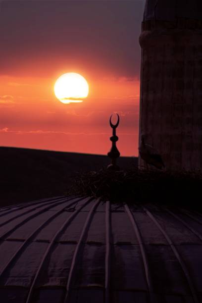 istock A mosque with a crescent moon in the sky 1491807787