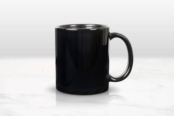 istock Glossy 11 oz. Black Mug Mockup in Luxury Marble Kitchen 1491807867