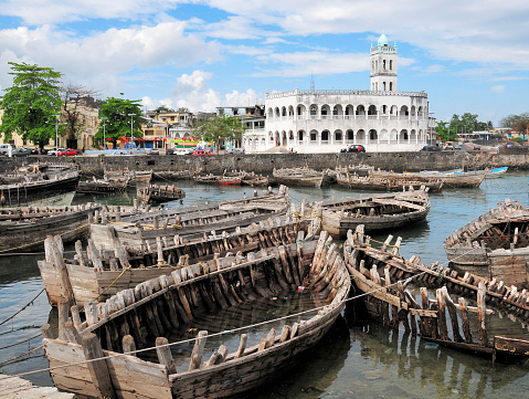 Moroni, Grande Comore / Ngazidja, Comoros islands: sunken wooden boats at the dhow port (Port aux Boutres), in front of the Cornche, with Badjanani Square and the Old Friday Mosque.