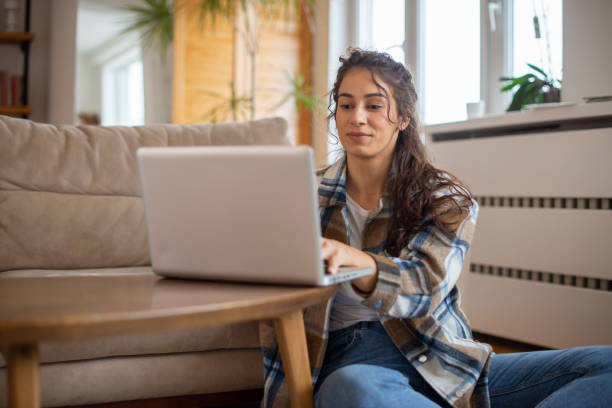 istock Young woman working from home 1491822097