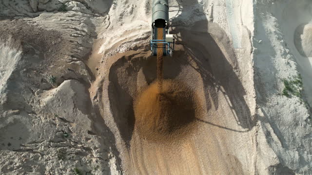 Excavator Working On Construction Site With Sand Conveyor Belt