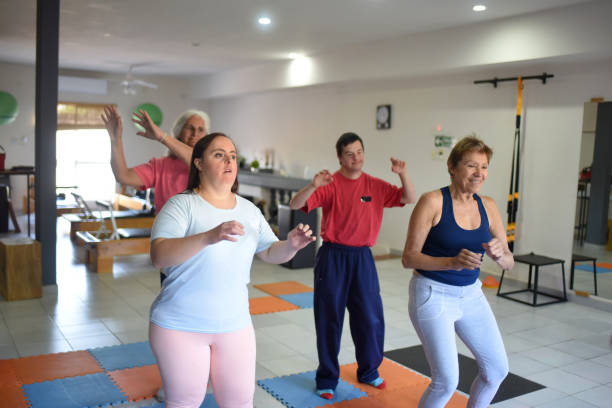 istock people doing zumba in a room 1491829630