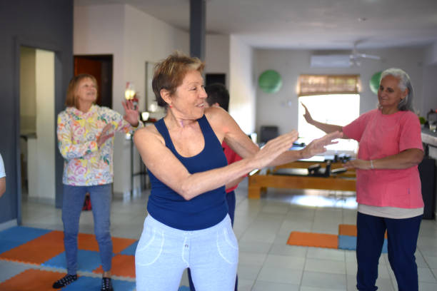 istock people doing zumba in a room 1491829740