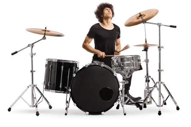 Male performer playing drums isolated on white background