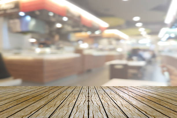 istock Top desk with blur restaurant background,wooden table 1491854435