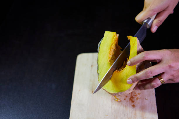 istock Cut piece of pumpkin and sliced on cutting board 1491858809