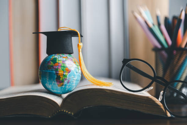 istock Graduation cap with Earth globe. Concept of global business study, abroad educational, Back to School. Education in Global world, Study abroad business in universities in worldwide. language study 1491861804