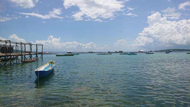 istock A boat under the blue sky, Palabusa village 1491862695