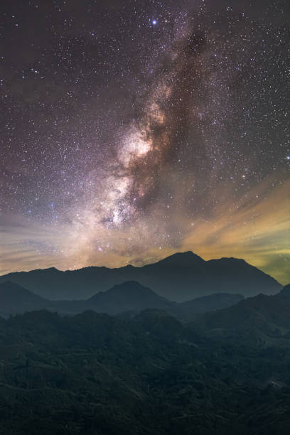 istock Scenic view of mountains against sky at night 1491868303