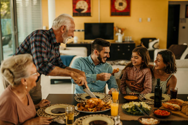 istock Multi Generation Family Enjoying Meal Around Table At Home Together 1491873681