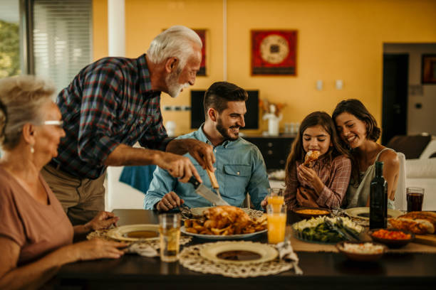 istock Multi Generation Family Enjoying Meal Around Table At Home Together 1491874136