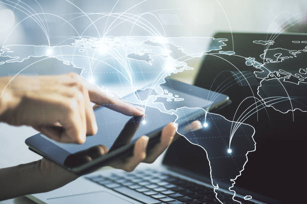 istock Double exposure of abstract digital world map with connections and hand working with a digital tablet on background, big data and blockchain concept 1491874230