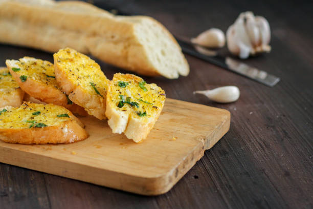 istock freshly toasted garlic bread on a white plate. 1491875471