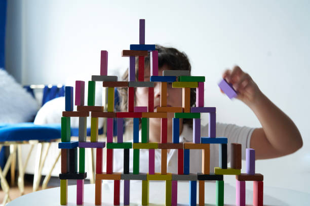 istock Cute Little Boy Playing with wooden block 1491876365