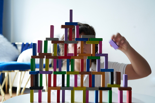 Cute Little Boy Playing with wooden block