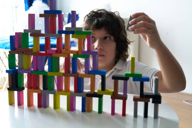 istock Cute Little Boy Playing with wooden block 1491876409