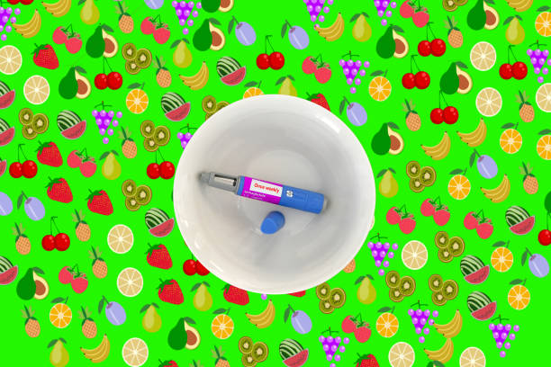 Semaglutide injection pen Semaglutide injection pen in a breakfast bowl with a fruit background wegovy stock pictures, royalty-free photos & images