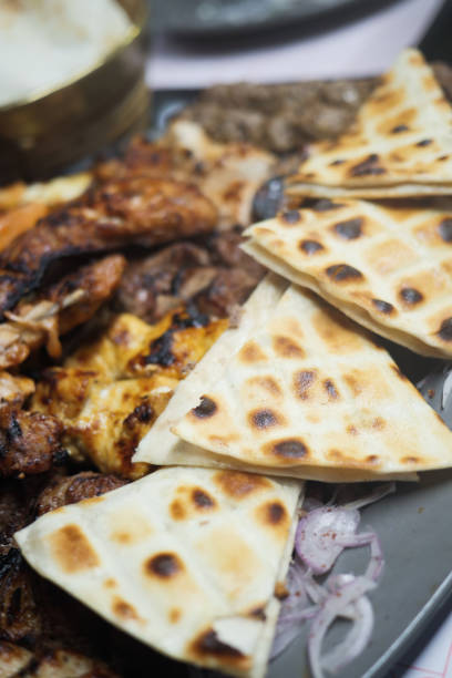 istock Seekh Kabab, Naan bread, and sauce on a plate 1491878620