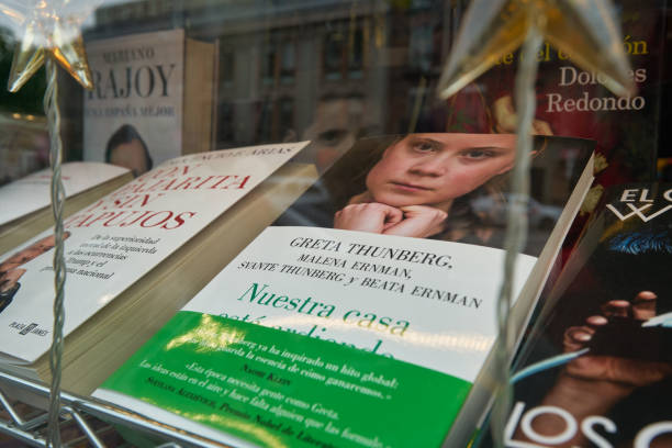 Close up shot of "Our house is burning: A family and a planet in crisis" Greta Thunberg's book on display. stock photo