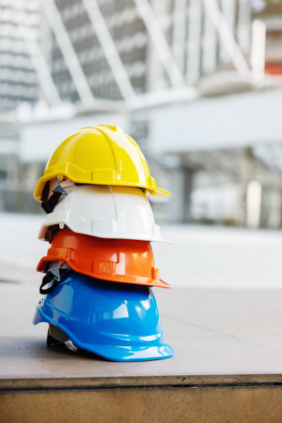 Helmets for construction workers, engineers, technicians, inspectors who work on construction sites. Safety hardhat while working to prevent accidents. work equipment of Blue collar - stock photo stock photo