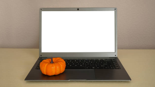 istock Laptop with white screen  and pumpkin. 1491884133
