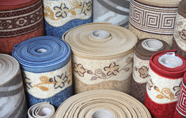 istock Carpets variety selection rolled up rugs shop store lot. Interior design concept idea 1491887264