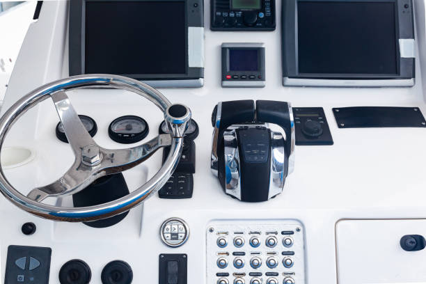 istock Luxury yacht control panel with steering wheel, gear levers, navigation devices, control buttons and on-board computer. 1491888807