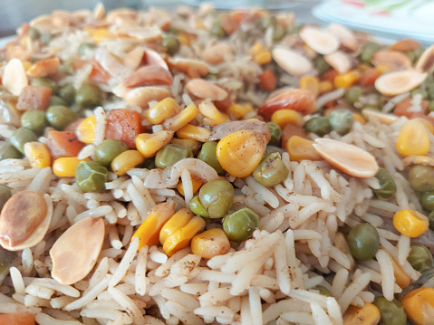 Ouzi Rice -  classic Arab meal that is known to have peas, carrots, lamb, or beef in a seasoned rice