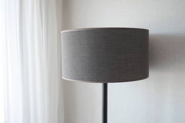 istock a lamp against white wall at home 1491891477