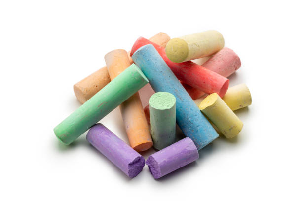 istock Concept kids: Pieces of colored chalk on a white background 1491893899