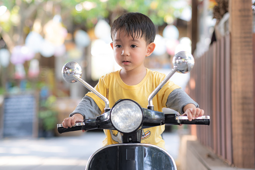 Baby Boy toddler riding driving Motorcycle or motorbike