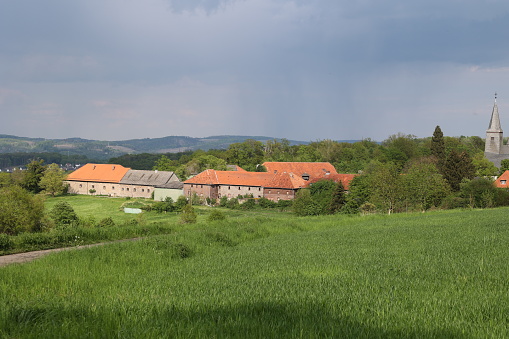 Ölinghausen monastery with dramatic sky im Sauerland