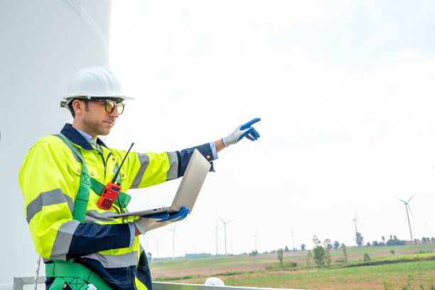 istock Engineer working at the natural energy wind turbine site,Wind turbine. 1491894823