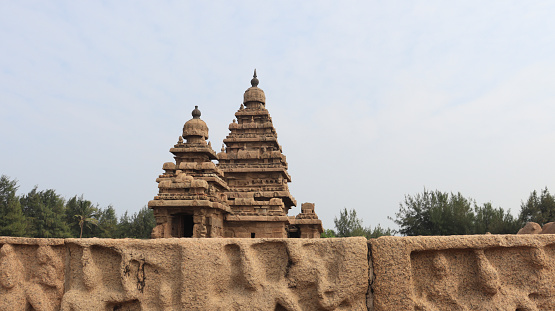 The Shore Temple, which was built in 700-728 AD, was given its name because it overlooks the shore of the Bay of Bengal. It is a structural temple, built with blocks of granite, dating from the 8th century AD. As one of the Group of Monuments at Mahabalipuram, it has been classified as a UNESCO World Heritage Site since 1984. It is one of the oldest structural stone temples in South India. Shore Temple is a complex of temples and shrines.