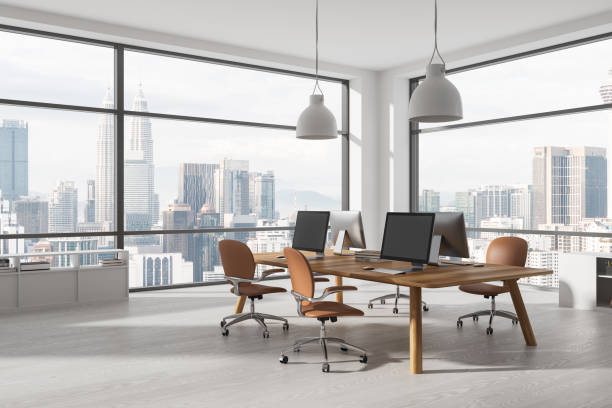 istock White office coworking interior with pc computer on desk and sideboard, window 1491896159