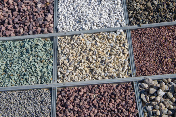 Colorful pebbles and stones in a square box as background