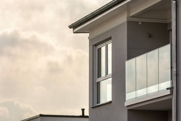 istock Modern apartment house with large windows and balcony with glass railing 1491906485