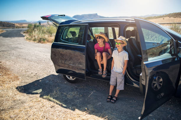 Happy kids taking a break during the road trip.