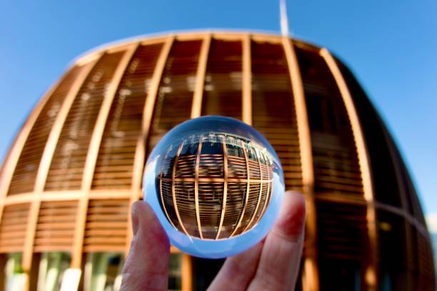 istock Hand holding crystal ball against modern buildings 1491921090