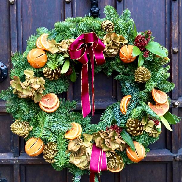 istock Christmas Wreath on a Wooden Door 1491923955