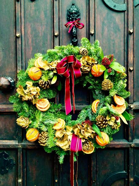istock Christmas Wreath on a Wooden Door 1491924532